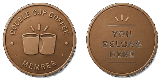 Double Cup member coins — one reading Double Cup Coffee · Member with two cups, the other You Belong Here.